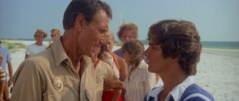 Movie still from “Jaws 2” (1978), directed by Jeannot Szwarc – A man and a boy talking to each other; Medium shot, Over the shoulder angle