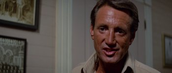 Movie still from “Jaws 2” (1978), directed by Jeannot Szwarc – A man's face in front of a white wall; Close Up shot, Low angle