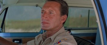 Movie still from “Jaws 2” (1978), directed by Jeannot Szwarc – A person wearing a uniform; Close Up shot, Low angle