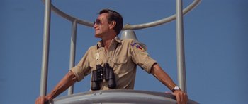 Movie still from “Jaws 2” (1978), directed by Jeannot Szwarc – A man standing on top of a metal structure; Medium shot, Low angle
