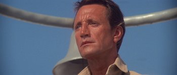 Movie still from “Jaws 2” (1978), directed by Jeannot Szwarc – A person wearing a tan shirt; Close Up shot, Low angle