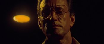 Movie still from “Jaws 2” (1978), directed by Jeannot Szwarc – A person wearing glasses; Close Up shot, Low angle