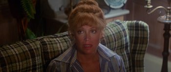 Movie still from “Jaws 2” (1978), directed by Jeannot Szwarc – A person wearing a plaid shirt; Close Up shot, Over the shoulder angle
