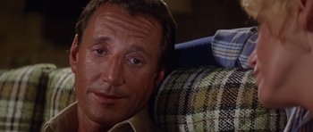 Movie still from “Jaws 2” (1978), directed by Jeannot Szwarc – A person laying on a couch; Close Up shot, Over the shoulder angle