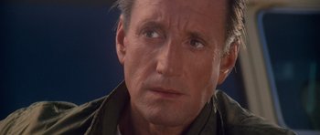 Movie still from “Jaws 2” (1978), directed by Jeannot Szwarc – A man's face looking at the camera; Close Up shot, Over the shoulder angle