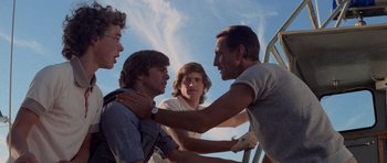 Movie still from “Jaws 2” (1978), directed by Jeannot Szwarc – A group of young men standing next to each other; Medium shot, Low angle