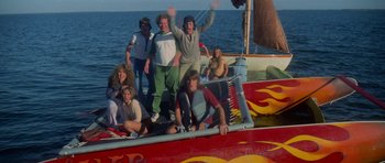 Movie still from “Jaws 2” (1978), directed by Jeannot Szwarc – A group of people standing on top of a boat in the water; Wide shot, High angle