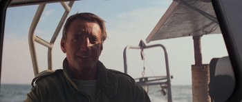Movie still from “Jaws 2” (1978), directed by Jeannot Szwarc – A person on a boat in the water; Close Up shot, Low angle