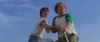 Movie still from “Jaws 2” (1978), directed by Jeannot Szwarc – Two young men are playing a video game together; Medium shot, Low angle