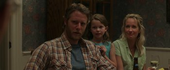 Movie still from “Jerry and Marge Go Large” (2022), directed by David Frankel – A man and a little girl standing next to each other; Medium shot, Over the shoulder angle