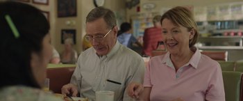 Movie still from “Jerry and Marge Go Large” (2022), directed by David Frankel – An older man and woman sitting at a table; Medium shot, Over the shoulder angle