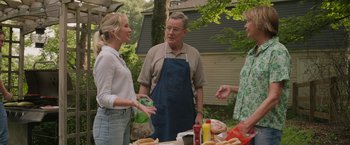 Movie still from “Jerry and Marge Go Large” (2022), directed by David Frankel – A man and two women standing around a table; Medium shot, Over the shoulder angle