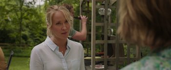 Movie still from “Jerry and Marge Go Large” (2022), directed by David Frankel – A woman standing next to a man on a wooden structure; Close Up shot, Over the shoulder angle