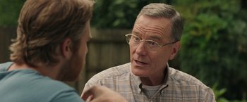 Movie still from “Jerry and Marge Go Large” (2022), directed by David Frankel – An older man talking to a younger man outside; Close Up shot, Over the shoulder angle