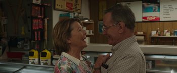 Movie still from “Jerry and Marge Go Large” (2022), directed by David Frankel – An older man and a younger woman laughing together; Close Up shot, Low angle