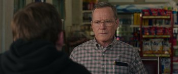 Movie still from “Jerry and Marge Go Large” (2022), directed by David Frankel – An older man wearing glasses and a plaid shirt; Close Up shot, Over the shoulder angle