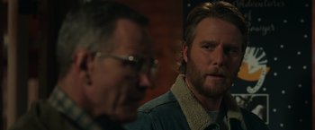 Movie still from “Jerry and Marge Go Large” (2022), directed by David Frankel – A man with a beard is looking at another man with glasses; Close Up shot, Over the shoulder angle