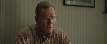 Movie still from “Jerry and Marge Go Large” (2022), directed by David Frankel – An older man wearing glasses and a plaid shirt; Close Up shot, Over the shoulder angle
