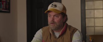 Movie still from “Jerry and Marge Go Large” (2022), directed by David Frankel – A person wearing a hat; Close Up shot, Over the shoulder angle