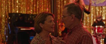 Movie still from “Jerry and Marge Go Large” (2022), directed by David Frankel – An older man and a younger woman looking at each other; Close Up shot, Over the shoulder angle