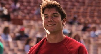Movie still from “Jerry Maguire” (1996), directed by Cameron Crowe – A person smiling at the camera; Close Up shot, Low angle