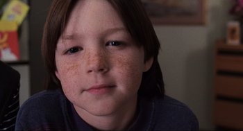 Movie still from “Jerry Maguire” (1996), directed by Cameron Crowe – A young person with freckles on his face; Close Up shot, High angle