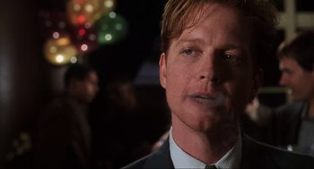 Movie still from “Jerry Maguire” (1996), directed by Cameron Crowe – A person wearing a suit and tie; Close Up shot, Over the shoulder angle