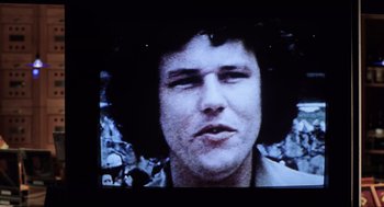 Movie still from “Jerry Maguire” (1996), directed by Cameron Crowe – A man's face on a television screen; Close Up shot, High angle