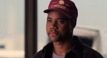 Movie still from “Jerry Maguire” (1996), directed by Cameron Crowe – A person wearing a hat; Close Up shot, Over the shoulder angle