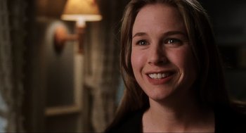 Movie still from “Jerry Maguire” (1996), directed by Cameron Crowe – A person smiling for the camera; Close Up shot, Over the shoulder angle