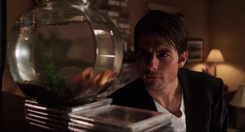 Movie still from “Jerry Maguire” (1996), directed by Cameron Crowe – A person looking at a plate of food; Close Up shot, Over the shoulder angle