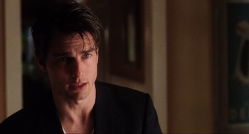 Movie still from “Jerry Maguire” (1996), directed by Cameron Crowe – A person wearing a suit; Close Up shot, Over the shoulder angle