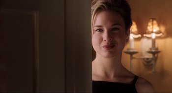 Movie still from “Jerry Maguire” (1996), directed by Cameron Crowe – A young woman is looking at the camera; Close Up shot, Over the shoulder angle