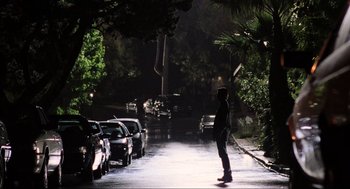 Movie still from “Jerry Maguire” (1996), directed by Cameron Crowe – A person standing on a street at night; Wide shot, Low angle