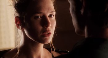 Movie still from “Jerry Maguire” (1996), directed by Cameron Crowe – A woman's face in a dark room; Close Up shot, Over the shoulder angle