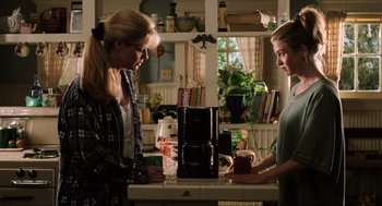 Movie still from “Jerry Maguire” (1996), directed by Cameron Crowe – Two women are standing in a kitchen looking at a coffee maker; Medium shot, Over the shoulder angle