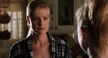 Movie still from “Jerry Maguire” (1996), directed by Cameron Crowe – A person wearing a plaid shirt; Close Up shot, Over the shoulder angle