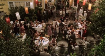 Movie still from “Jerry Maguire” (1996), directed by Cameron Crowe – A group of people sitting at tables with food; Wide shot, High angle