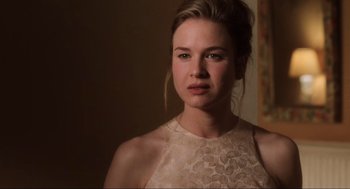 Movie still from “Jerry Maguire” (1996), directed by Cameron Crowe – A beautiful young lady wearing a white dress; Close Up shot, Over the shoulder angle