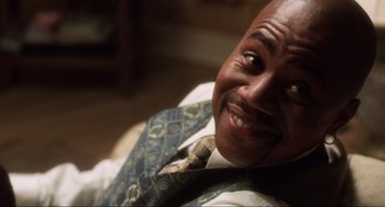 Movie still from “Jerry Maguire” (1996), directed by Cameron Crowe – A person wearing a vest and a tie; Close Up shot, Low angle