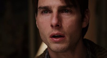 Movie still from “Jerry Maguire” (1996), directed by Cameron Crowe – A man's face as he stares into the distance; Close Up shot, Over the shoulder angle