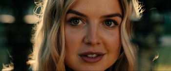 Movie still from “Jesus Revolution” (2023), directed by Brent McCorkle – A woman's face with green eyes; Close Up shot, Low angle