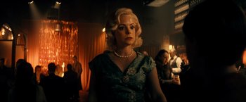 Movie still from “Jesus Revolution” (2023), directed by Brent McCorkle – A woman with blonde hair wearing a blue dress; Medium shot, Low angle