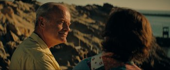 Movie still from “Jesus Revolution” (2023), directed by Brent McCorkle – A man and a woman are talking to each other; Close Up shot, Over the shoulder angle