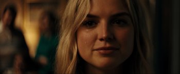 Movie still from “Jesus Revolution” (2023), directed by Brent McCorkle – A woman's face with tears in her eyes; Close Up shot, Low angle