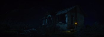 Movie still from “Joe Bell” (2020), directed by Reinaldo Marcus Green – A house that has been destroyed in the dark; Extreme Wide shot, Low angle