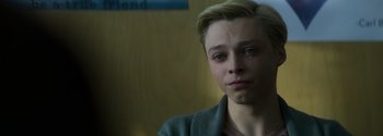Movie still from “Joe Bell” (2020), directed by Reinaldo Marcus Green – A person looking sad with his eyes wide open; Close Up shot, Over the shoulder angle