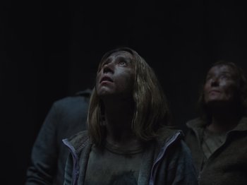 Movie still from “John and the Hole” (2021), directed by Pascual Sisto – A woman looking up in the dark with her eyes wide open; Close Up shot, Low angle