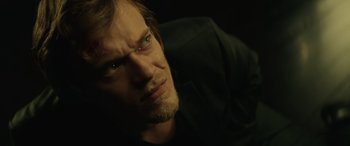 Movie still from “John Wick” (2014), directed by Chad Stahelski – A person looking at the camera; Close Up shot, High angle