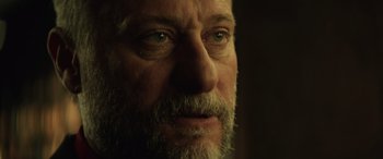 Movie still from “John Wick” (2014), directed by Chad Stahelski – A person with a beard; Close Up shot, Over the shoulder angle